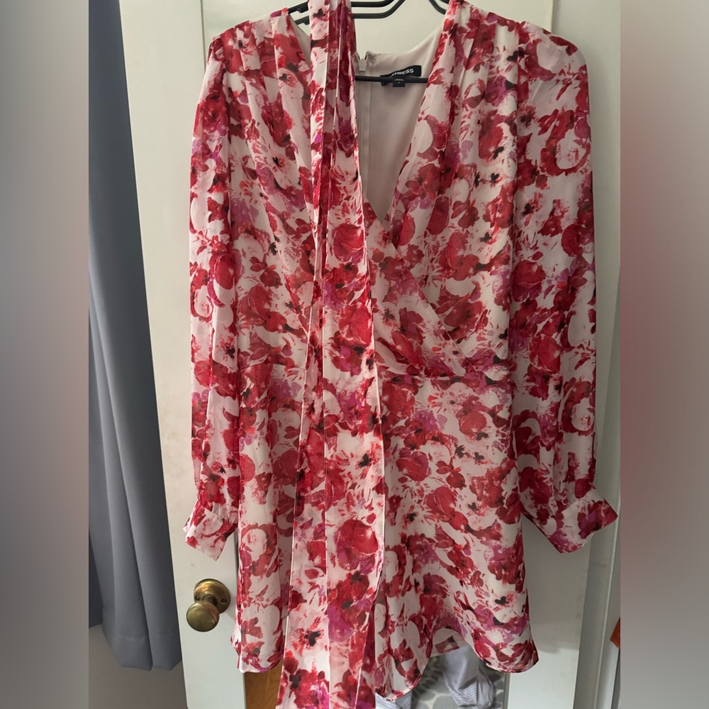 Express floral romper with belt. Worn once